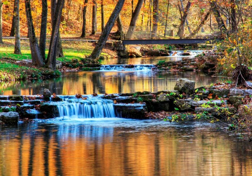 Dogwood Canyon Nature Park walking path at Big Cedar Dogwood Canyon Nature Park walking path and bridge over streams and waterfalls at Big Cedar.