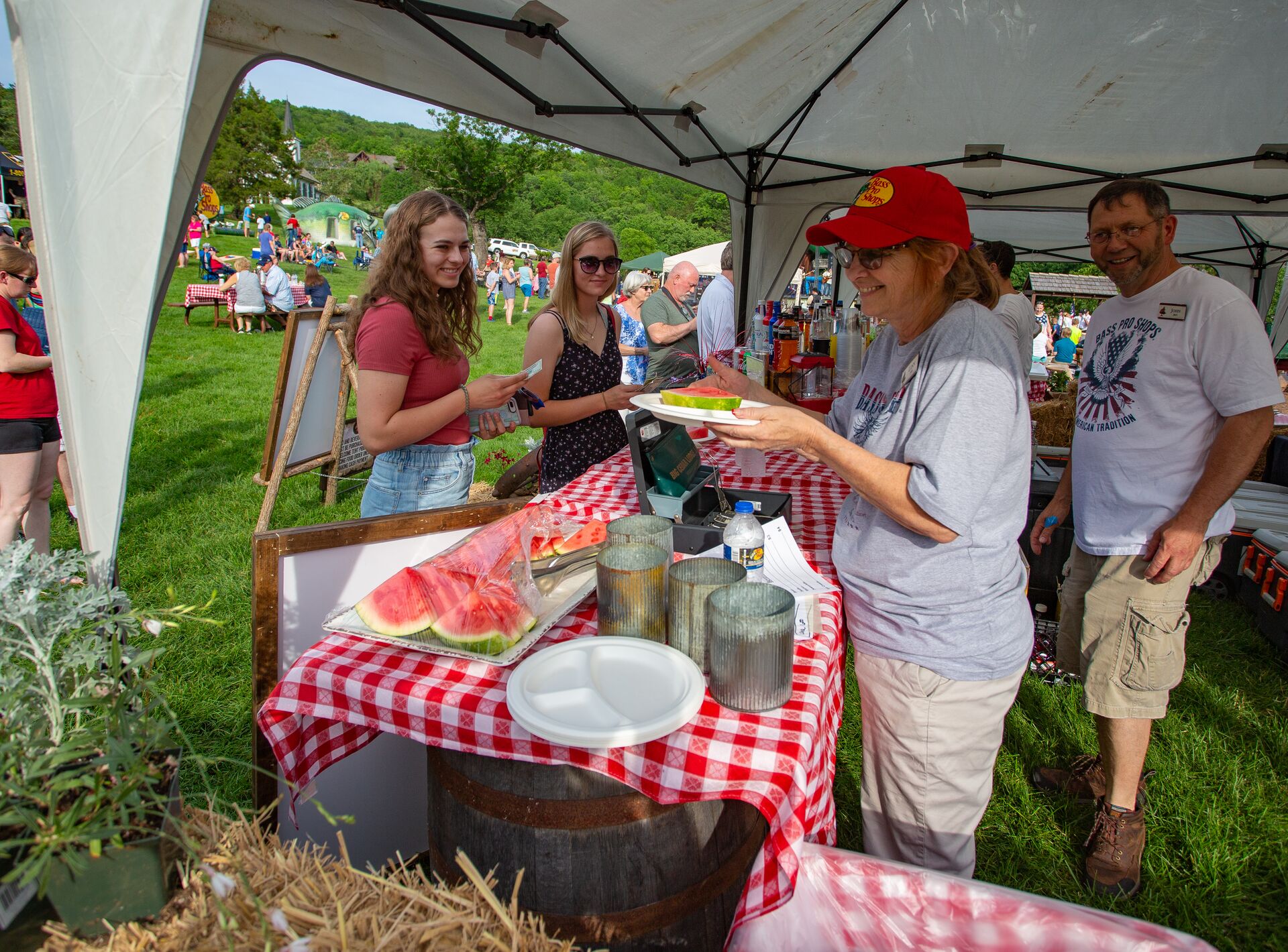 staff feeding attendees at memorial day picnic
