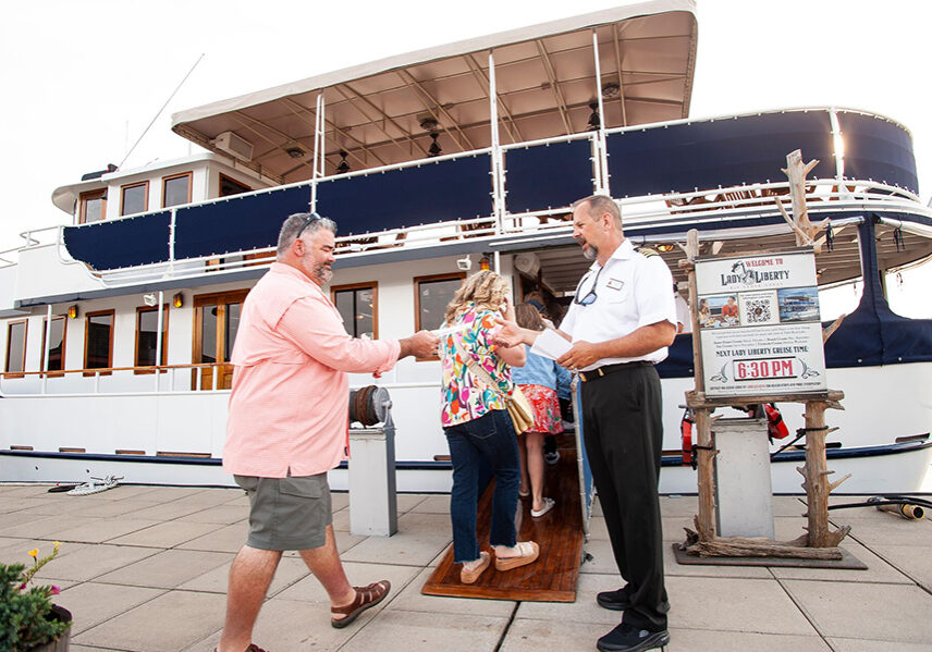 guests are greeted and board the lady liberty