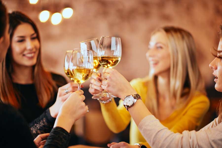 Galentine's-Day Four ladies enjoying wine