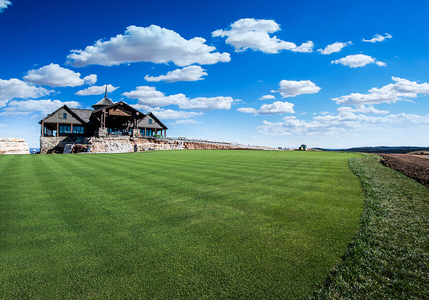 putting complex green with mountain top clubhouse
