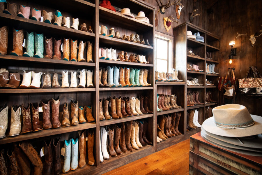 HiRes JPG-2024_TopoftheRock_ArniesGeneralStore_3 Arnies general store boot wall
