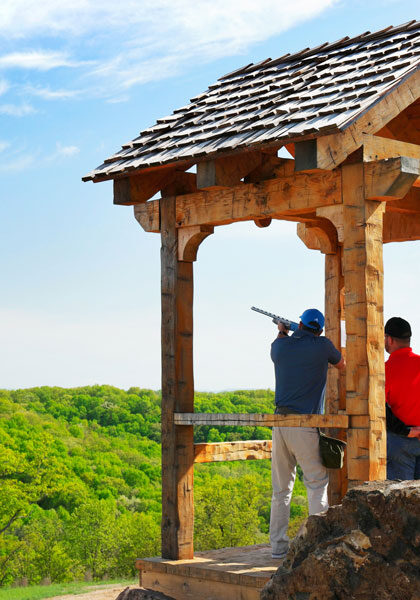 Bass Pro Shops Shooting Academy at Big Cedar training Man being trained on shooting at Bass Pro Shops Shooting Academy at Big Cedar