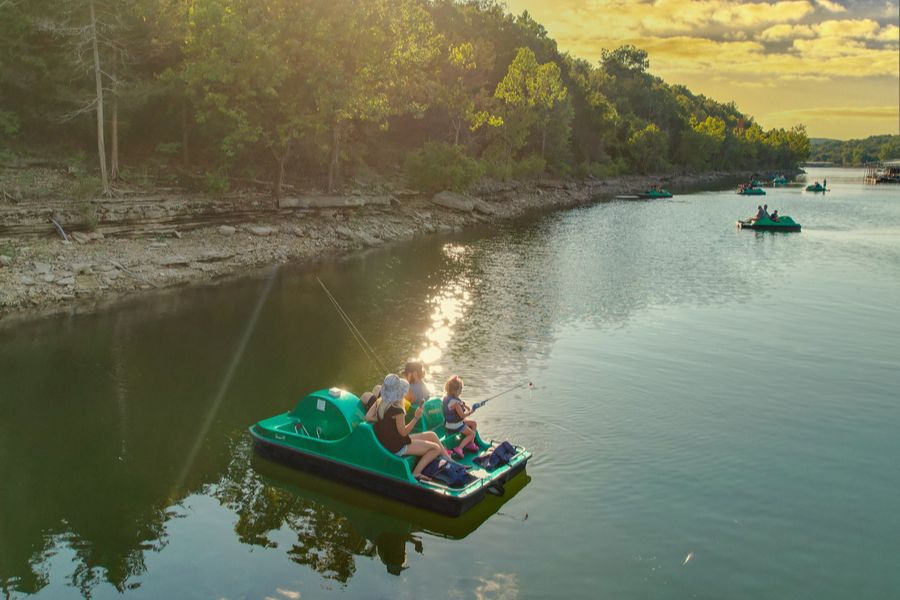 A family enjoys Pedal Boat Fishing on Table Rock Lake at Big Cedar Lodge.