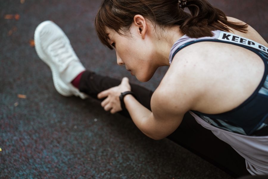 Mobility and Strength A woman stretches during a workout.