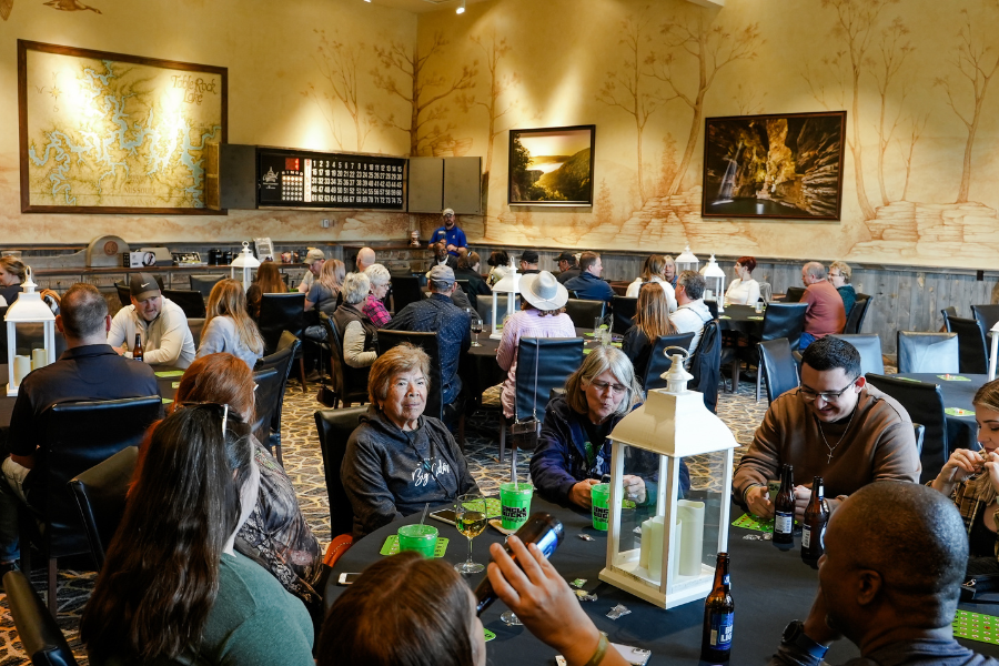 Adults enjoying bingo night with beverages